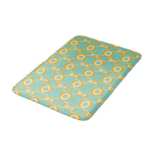 Stylized geometric pattern in bold orange hexagon bath mat