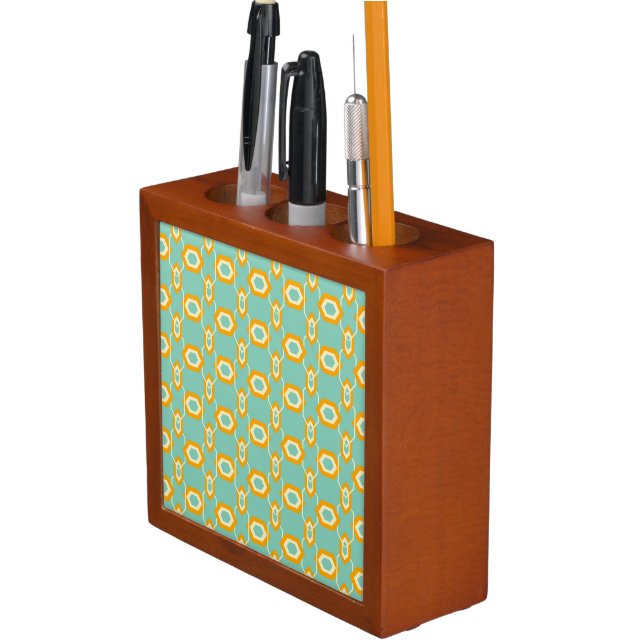 Stylized geometric pattern in bold orange hexagon desk organizer (In Situ)