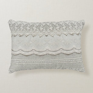 Subtle white lace, textile close-up. accent pillow
