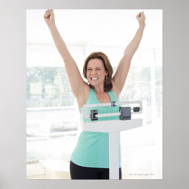 Successful weight loss. Happy woman weighing Poster (Front)