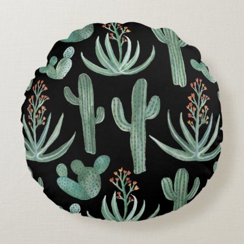 Succulents and saguaro cacti plants on black round pillow