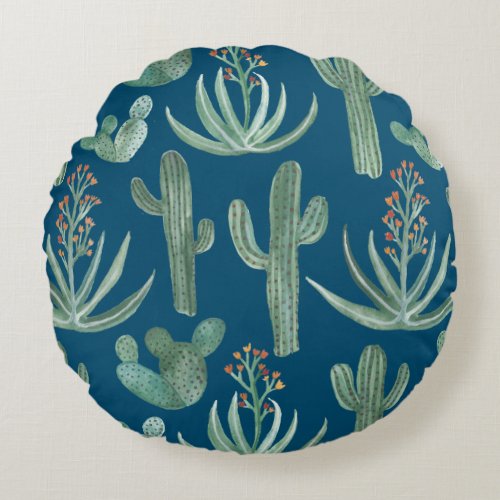 Succulents and saguaro cacti plants on blue round pillow