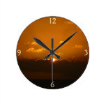 Sun Behind Clouds I Orange Seascape Round Clock
