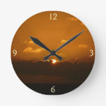 Sun Behind Clouds I Orange Sunset Photo Round Clock