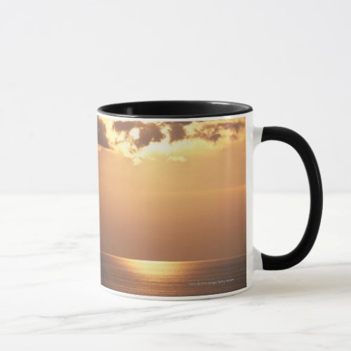 Sun goes down on the ocean mug