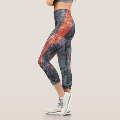 Sun light on snowy mountains capri leggings