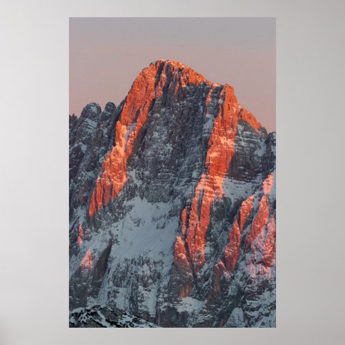 Sun light on snowy mountains poster