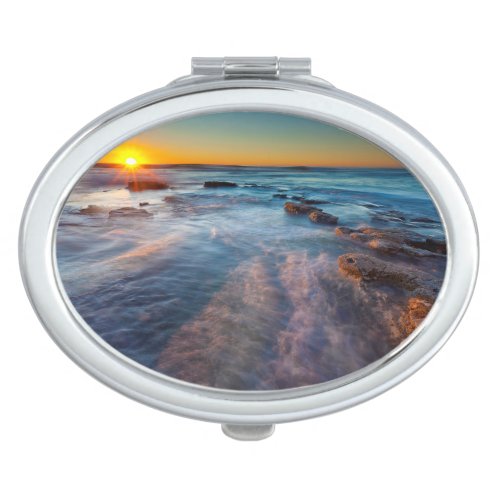 Sun rays illuminate the Pacific Ocean Compact Mirror