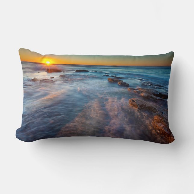 Sun rays illuminate the Pacific Ocean Lumbar Pillow (Front)