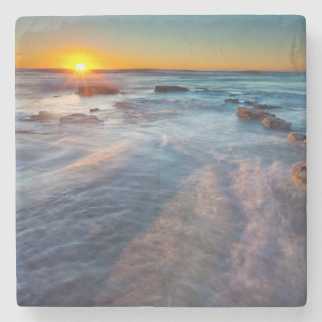 Sun rays illuminate the Pacific Ocean Stone Coaster (Front)