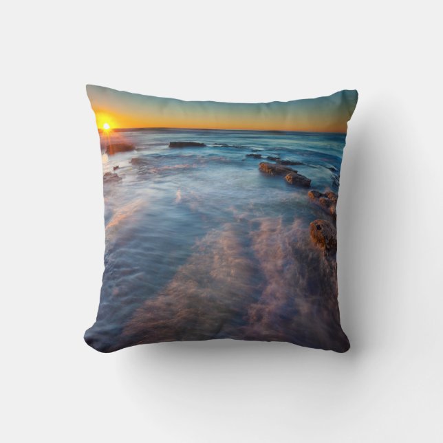 Sun rays illuminate the Pacific Ocean Throw Pillow (Front)