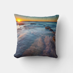 Sun rays illuminate the Pacific Ocean Throw Pillow