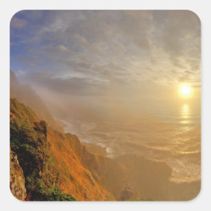 Sun sets over the Pacific Ocean from Heceta Square Sticker