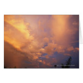 Sun setting behind clouds (Front Horizontal)