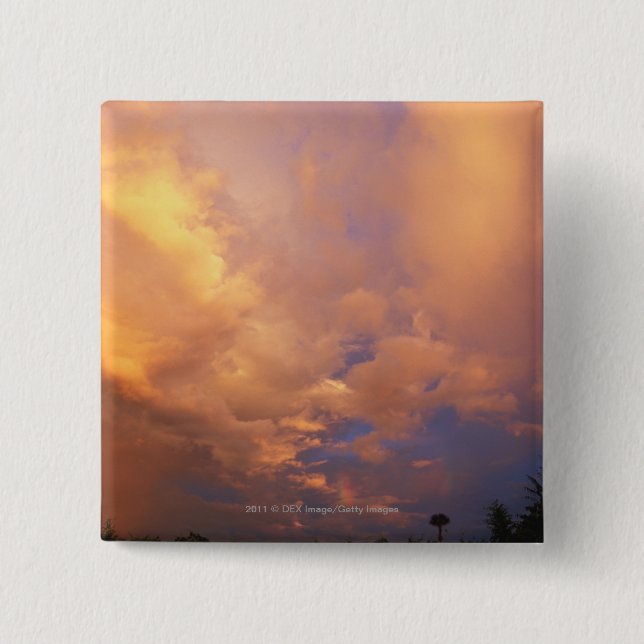 Sun setting behind clouds button (Front)