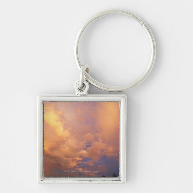 Sun setting behind clouds keychain (Front)