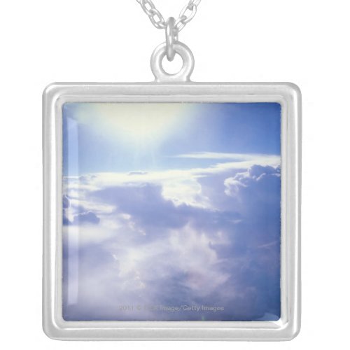 Sun shinning through clouds silver plated necklace