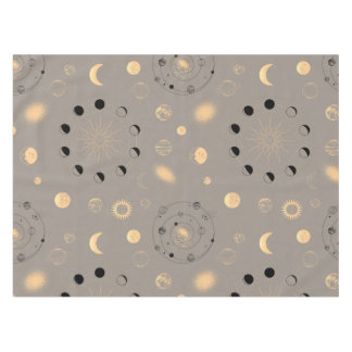 Sun stars moon phases planets black gold on tan tablecloth