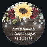 Sunflower and Burgundy Red Rose Rustic Wedding Classic Round Sticker<br><div class="desc">Design features a barn wood grain background decorated with a floral element at the top that consists of watercolor garden eucalyptus,  greenery,  burgundy red roses and a sunflower. Design also features twinkle string lights with country rustic lighted mason jars.</div>