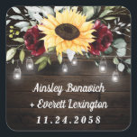 Sunflower and Burgundy Red Rose Rustic Wedding Square Sticker<br><div class="desc">Design features a barn wood grain background decorated with a floral element at the top that consists of watercolor garden eucalyptus,  greenery,  burgundy red roses and a sunflower. Design also features twinkle string lights with country rustic lighted mason jars.</div>