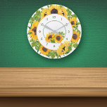 Sunflower Circle Floral Round Clock<br><div class="desc">Bright, cheerful sunflower and leaf images make a pretty frame on this kitchen clock. The sunflower border is in predominant colors of yellow gold, green, and brown. At the lower center is a second image of matching sunflowers. Brown numbers make the clock easy to read, and a thin green circle...</div>