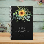 Sunflower eucalyptus greenry black name 2024 planner<br><div class="desc">A black background.  Decorated with sunflowers,  eucalyptus greenery.  Add a name,  text. The name is written with a modern hand lettered style script with swashes. 
To keep the swashes only delete the sample name,  leave the spaces or emoji's in front and after the name.</div>