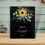 Sunflower eucalyptus greenry black name 2024 planner<br><div class="desc">A black background.  Decorated with sunflowers,  eucalyptus greenery.  Add a name,  text. The name is written with a modern hand lettered style script with swashes. 
To keep the swashes only delete the sample name,  leave the spaces or emoji's in front and after the name.</div>