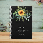 Sunflower eucalyptus greenry black name 2025 planner<br><div class="desc">A black background.  Decorated with sunflowers,  eucalyptus greenery.  Add a name,  text. The name is written with a modern hand lettered style script with swashes. 
To keep the swashes only delete the sample name,  leave the spaces or emoji's in front and after the name.</div>