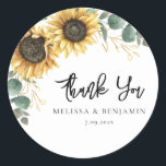 Sunflower Eucalyptus Wedding Script Thank You Classic Round Sticker<br><div class="desc">Create a modern Sunflower Floral thank you favor sticker with this cute template featuring beautiful rustic floral bouquet, geometric gold effect leaves, with modern simple typography. TIP: Matching wedding suite cards like RSVP, wedding programs, banners, tapestry, gift tags, signs, and other wedding keepsakes and goodies are available in the collection...</div>