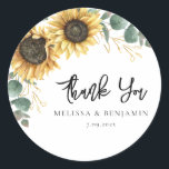 Sunflower Eucalyptus Wedding Script Thank You Classic Round Sticker<br><div class="desc">Create a modern Sunflower Floral thank you favor sticker with this cute template featuring beautiful rustic floral bouquet, geometric gold effect leaves, with modern simple typography. TIP: Matching wedding suite cards like RSVP, wedding programs, banners, tapestry, gift tags, signs, and other wedding keepsakes and goodies are available in the collection...</div>