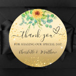 Sunflower gold glitter thank you wedding  classic round sticker<br><div class="desc">A faux gold background,  decorated with a sunflower and eucalyptus greenera and golden sparkles.   With the text: Thank you for sharing our special day,  with a small heart.   Personalize and add your names.</div>
