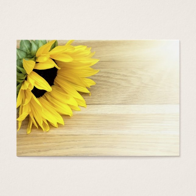 Sunflower laying on a wooden table (Front)