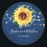 Sunflower Navy Babys Breath Lights Wedding Classic Round Sticker<br><div class="desc">These wedding stickers feature a rustic sunflower, babys breath flowers and string lights on a navy blue wood grain background. Personalize these stickers with your names and wedding date. These stickers are part of a collection which includes matching wedding stationery and gifts. Please visit the collection pages in our store...</div>