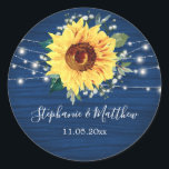 Sunflower Navy Babys Breath Lights Wedding Classic Round Sticker<br><div class="desc">These wedding stickers feature a rustic sunflower, babys breath flowers and string lights on a navy blue wood grain background. Personalize these stickers with your names and wedding date. These stickers are part of a collection which includes matching wedding stationery and gifts. Please visit the collection pages in our store...</div>