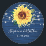 Sunflower Navy Babys Breath Lights Wedding Classic Round Sticker<br><div class="desc">These wedding stickers feature a rustic sunflower, babys breath flowers and string lights on a navy blue wood grain background. Personalize these stickers with your names and wedding date. These stickers are part of a collection which includes matching wedding stationery and gifts. Please visit the collection pages in our store...</div>