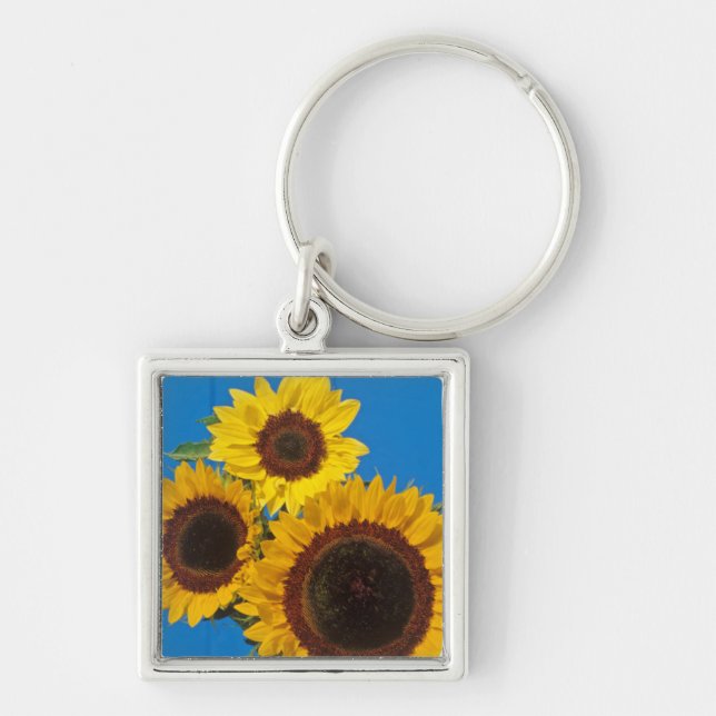 Sunflowers against blue fence keychain (Front)