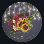 Sunflowers and burgundy roses rustic navy wedding classic round sticker<br><div class="desc">Editable text wedding favor sticker or envelope seal featuring a rustic big beautiful yellow sunflowers and red burgundy roses bouquet and faux gold typography script on a dark midnight navy blue background with string lights. Ideal for your winter, Christmas floral, late summer night or autumn fall | elegant rustic country...</div>