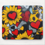 sunflowers and hearts mouse pad<br><div class="desc">This vibrant mural features a colorful mix of sunflowers and hearts. The sunflowers are depicted with bright yellow petals and red centers, while the hearts are scattered throughout the artwork in various shades of red. The background is a mix of abstract geometric patterns and textures, creating a dynamic and eye-catching...</div>
