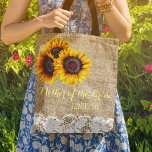 Sunflowers burlap lace wedding mother of the bride tote bag<br><div class="desc">Rustic elegant summer or autumn fall wedding stylish mother of the bride / mother of the groom / bridesmaid / maid of honor / flower girl tote bag on beige faux burlap featuring beautiful yellow gold sunflowers bouquets and white lace borders on both faces. Easy to personalize with bridesmaid's name...</div>