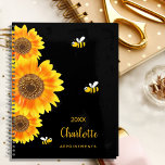 Sunflowers monogram cute bees black planner<br><div class="desc">A chic black background color.  Decorated with large watercolored sunflowers and 3 cute,  happy smiling bees.  Personalize and add a name,  year and a title. The name is written in black with a large modern hand lettered style script. Perfect for school,  work or organizing your personal/family life</div>