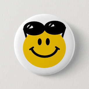 Sunglasses perched on top of head face button