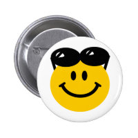 Sunglasses perched on top of head smiley face button