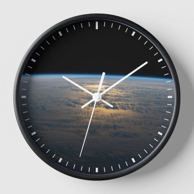 Sunglint Beams Off A Partly Cloudy South Pacific Clock (Front)