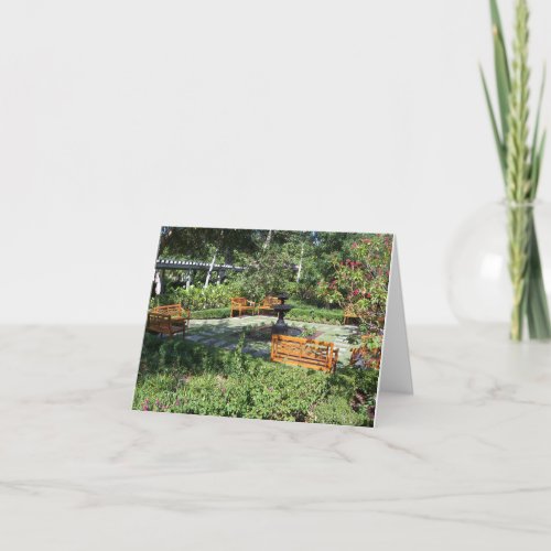 Sunny garden and fountain on a thank you card