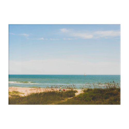 Sunny Ocean View with Beach Umbrella and Sailboat Acrylic Print