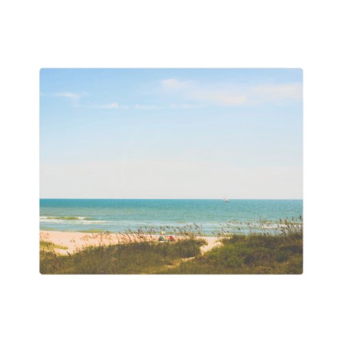 Sunny Ocean View with Beach Umbrella and Sailboat Metal Print