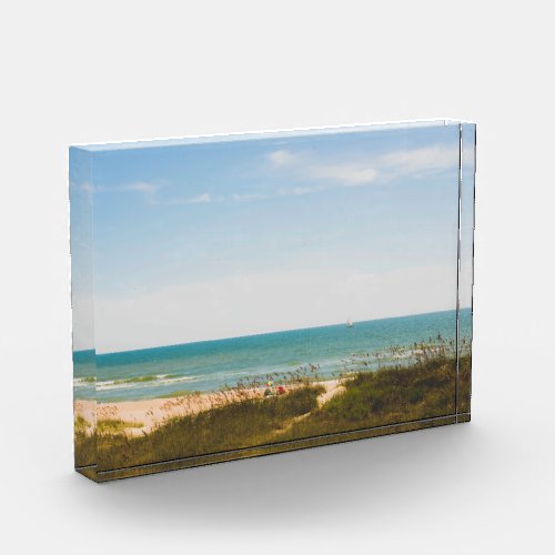 Sunny Ocean View with Beach Umbrella and Sailboat Photo Block