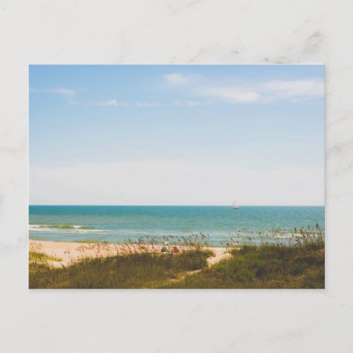 Sunny Ocean View with Beach Umbrella and Sailboat Postcard
