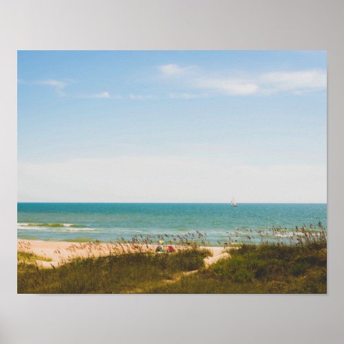 Sunny Ocean View with Beach Umbrella and Sailboat Poster