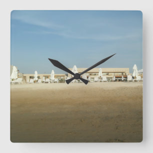 Sunny Resort Beach with White Loungers and Blue Sk Square Wall Clock